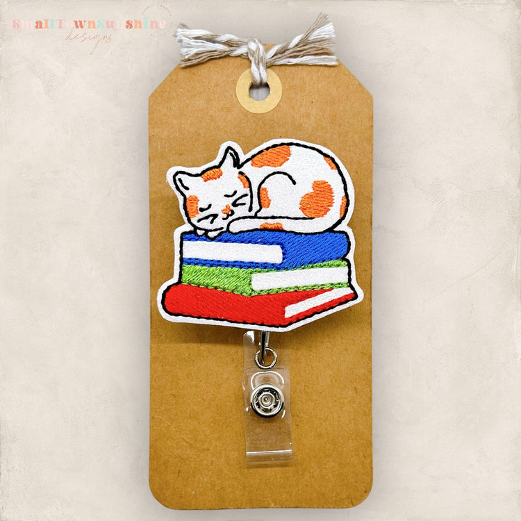 Orange Cat on Book Stack Badge Topper