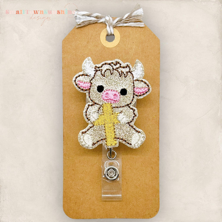 Highland Cow Holding Cross Badge Topper