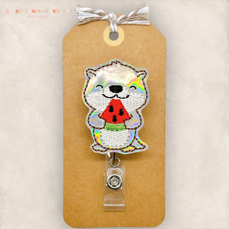 embroidered otter with watermelon badge reel