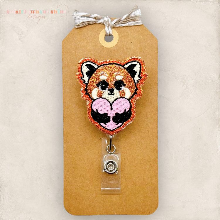 red panda hugging heart badge reel