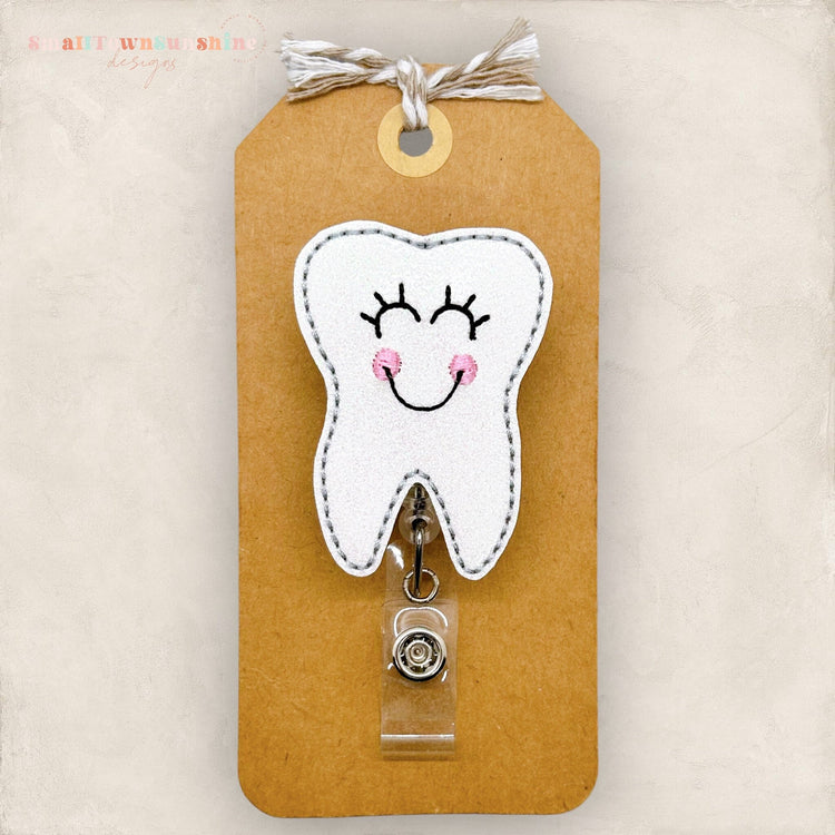 happy tooth badge reel