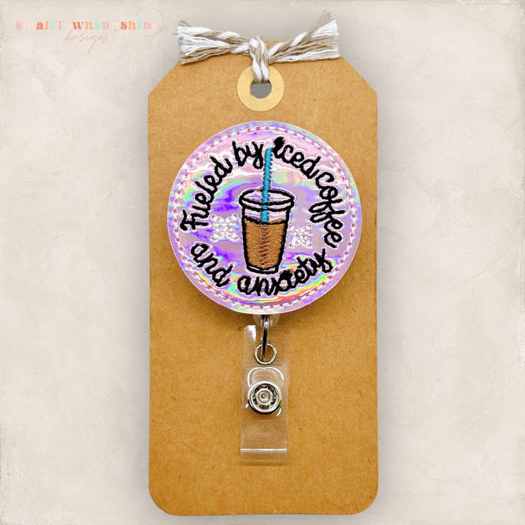 fueled by iced coffee and anxiety pink holographic badge reel