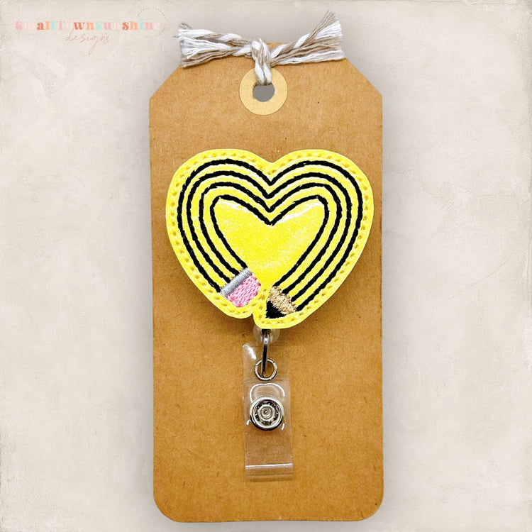 pencil shaped like a heart badge reel