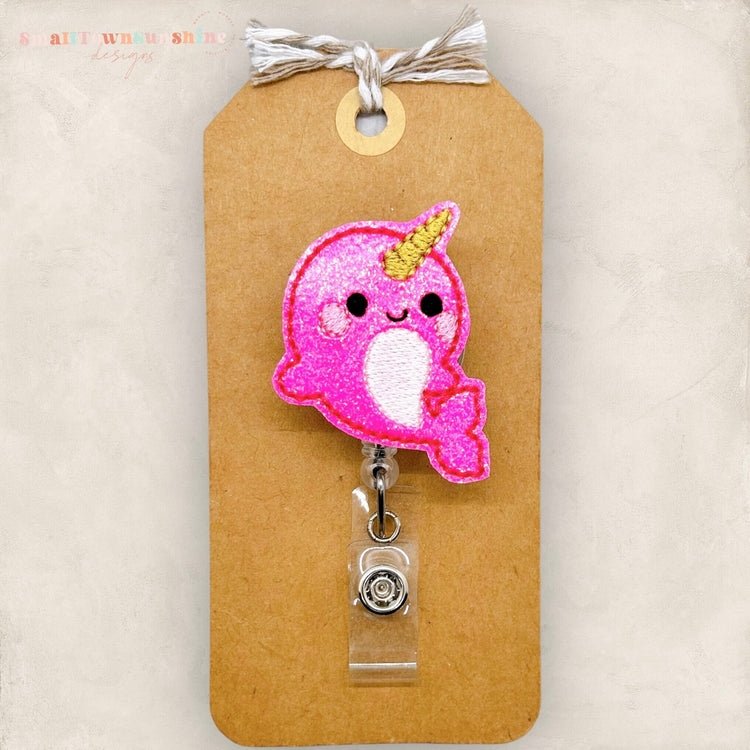 pink narwhal badge reel