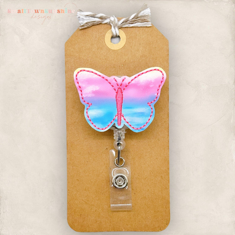 pastel colored butterfly badge reel