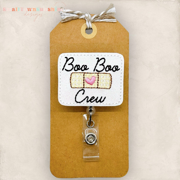 boo boo crew with an adhesive bandage badge reel