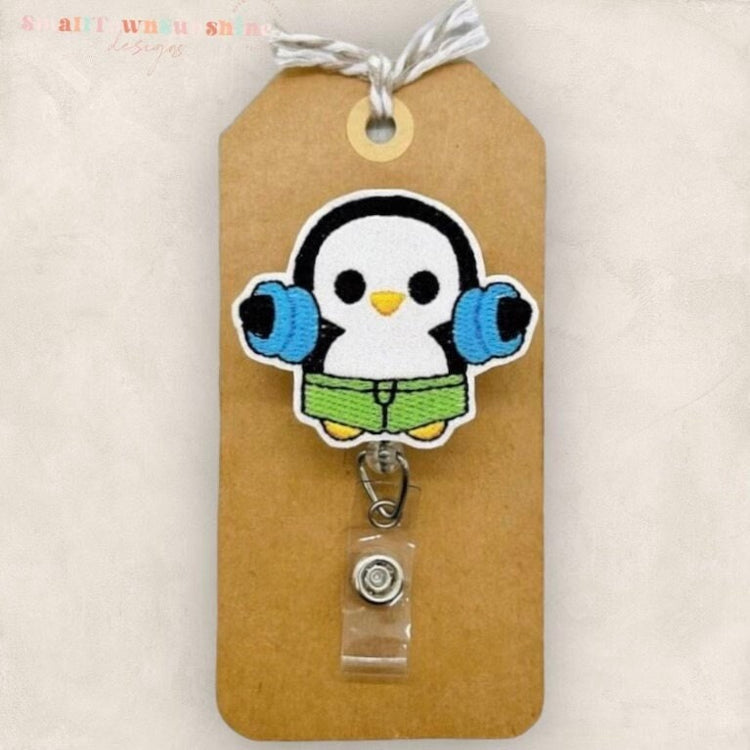 penguin with pool floaties badge reel