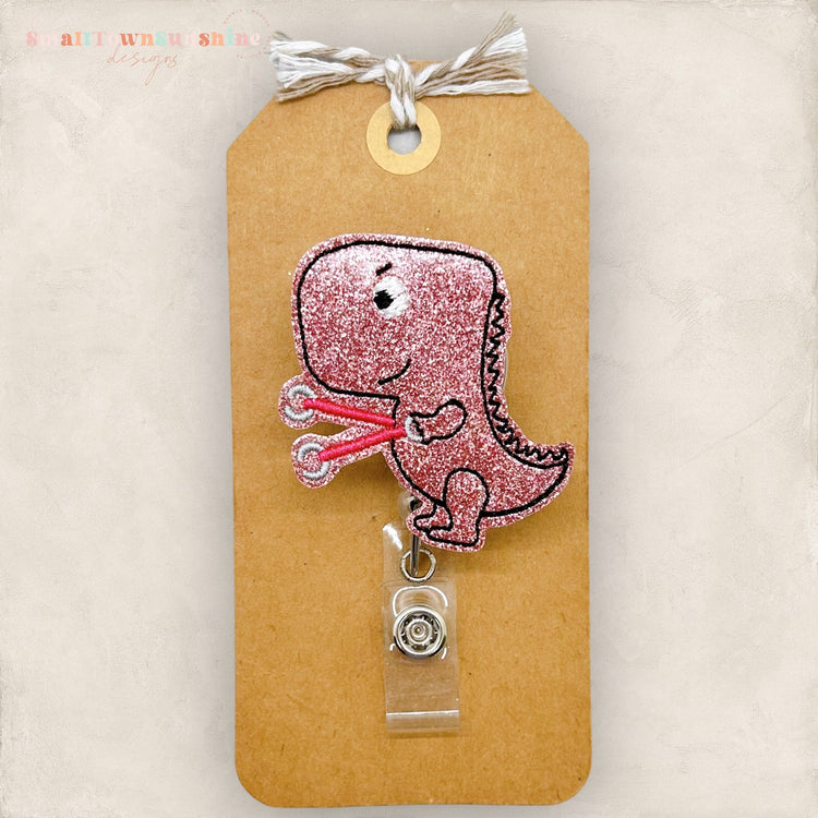 pink occupational therapy t-rex badge reel