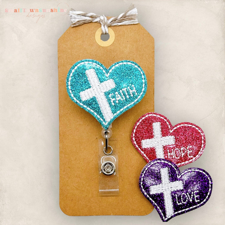 faith, hope or love heart badge reel with a cross