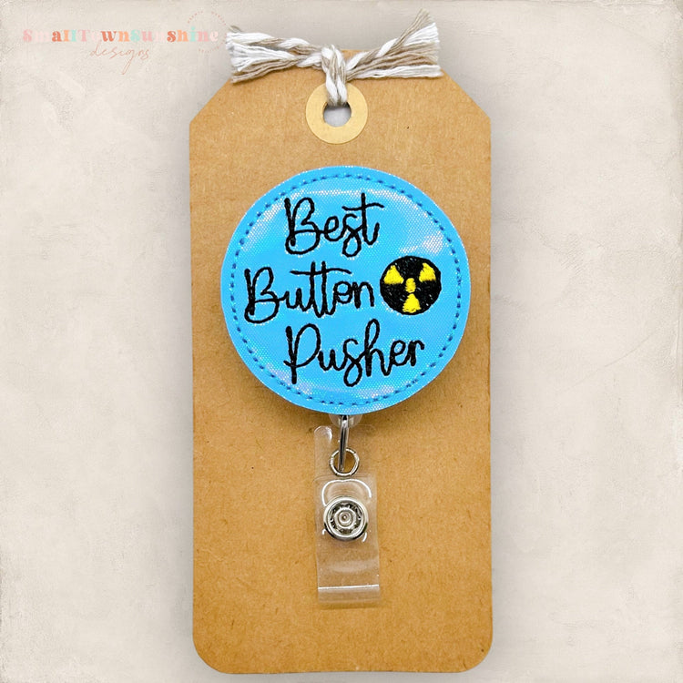best button pusher badge reel