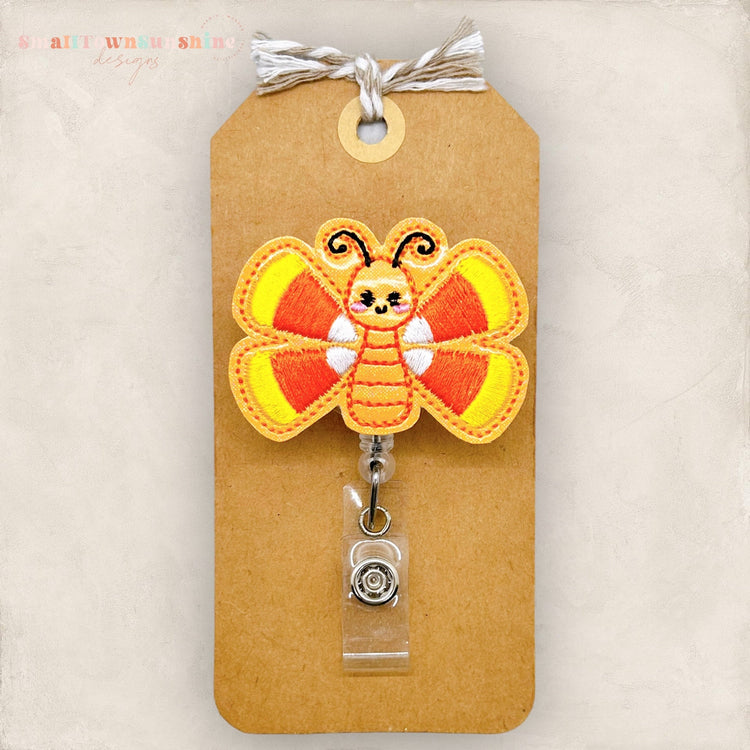 orange butterfly with candy corn wings badge reel