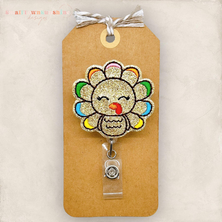 glittery turkey with colorful feather tips badge reel