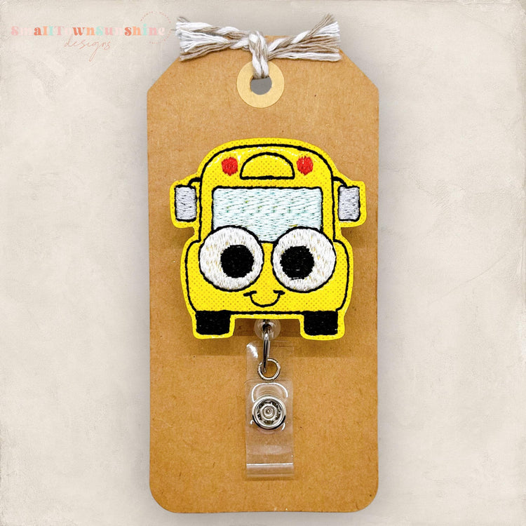 googly eyed school bus badge reel