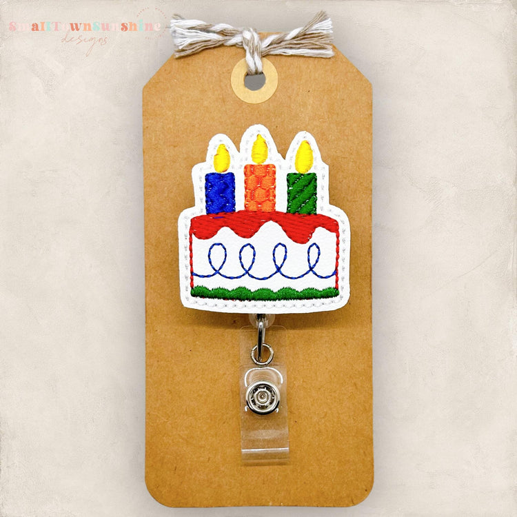 birthday cake badge reel, no glitter primary color cake for men