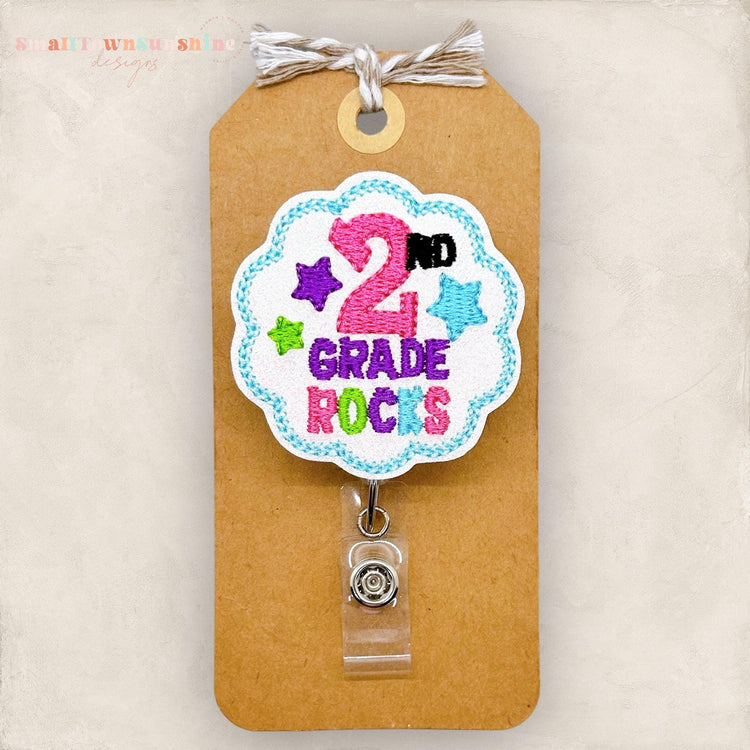 second grade rocks embroidered badge reel