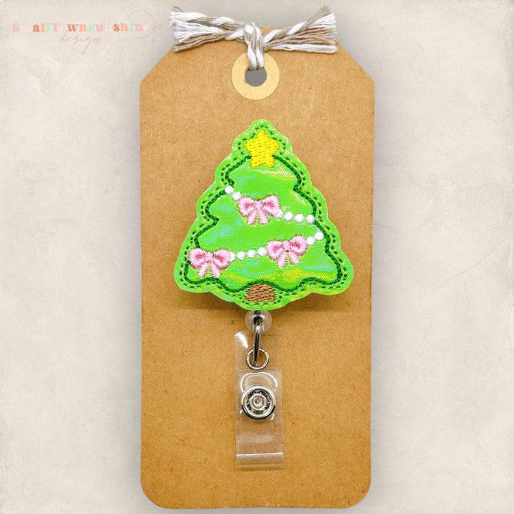 coquette style embroidered christmas tree badge reel