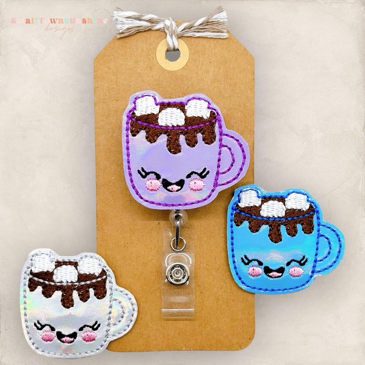 shiny hot chocolate cups with chocolate and marshmallows embroidered, winter badge reels