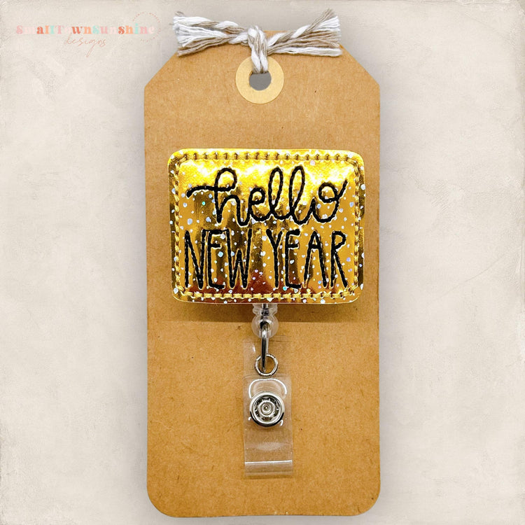 gold hello new year embroidered badge reel