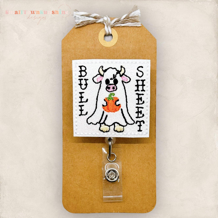 cow ghost holding pumpkin with words bull sheet, embroidered badge reel topper