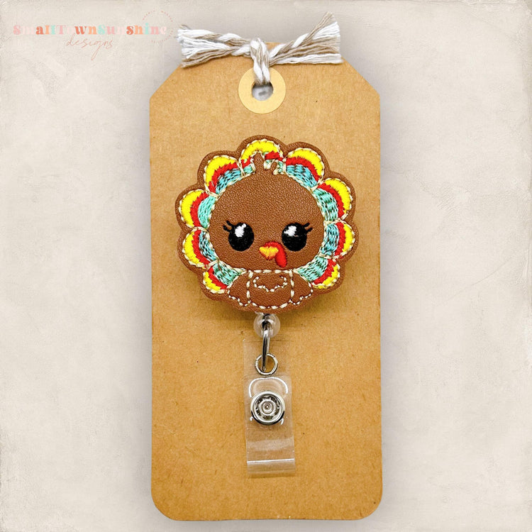 brown turkey with big eyes badge reel