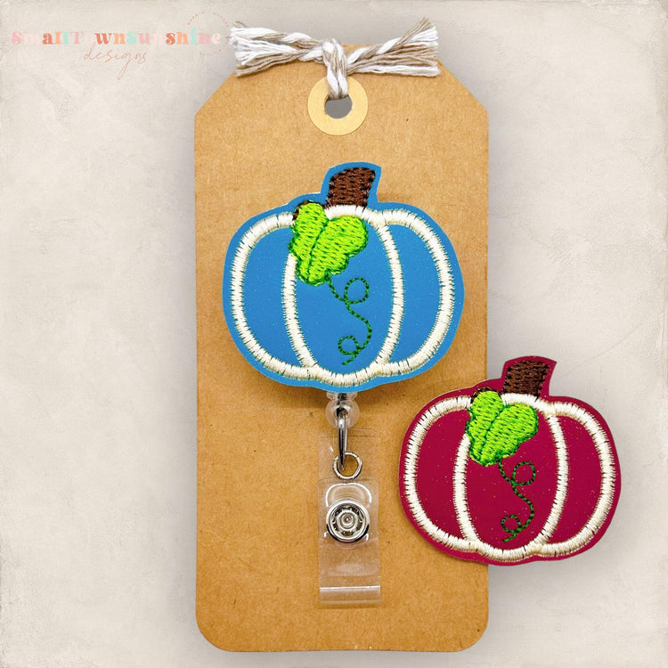 embroidered pumpkin with leaf for badge reels in teal or burgundy