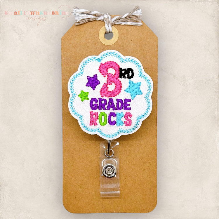 3rd grade rocks embroidered badge reel