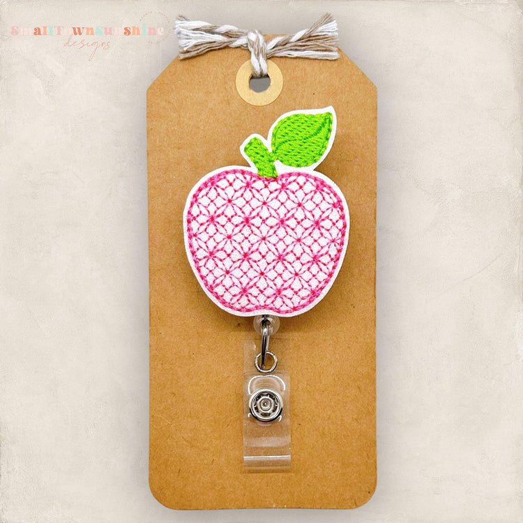sketched pink apple embroidered badge reel
