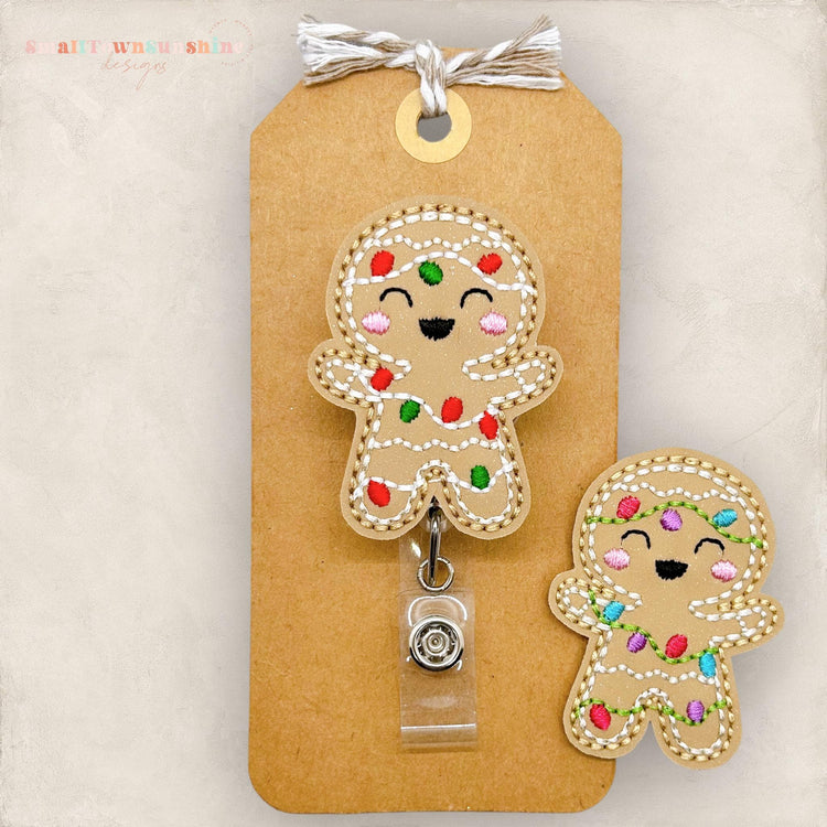 christmas lights wrapped around a gingerbread cookie badge reel