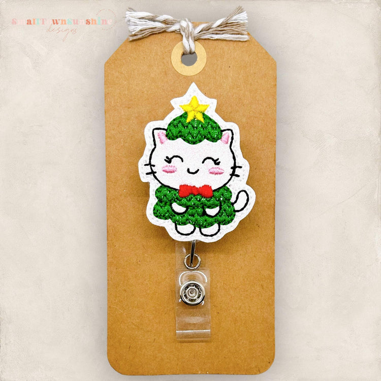 white cat dressed as a christmas tree badge reel