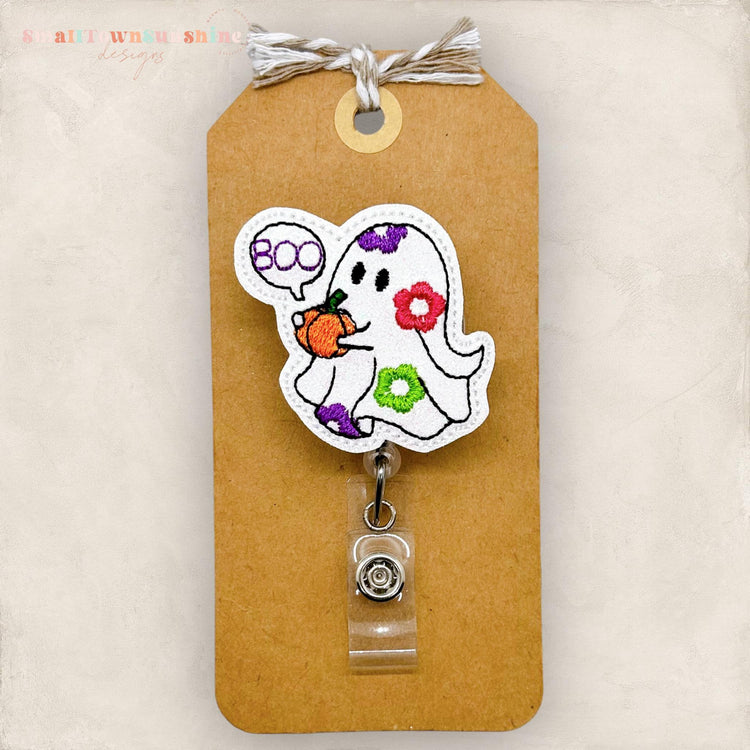 retro daisy boo ghost holding a pumpkin embroidered badge reel topper