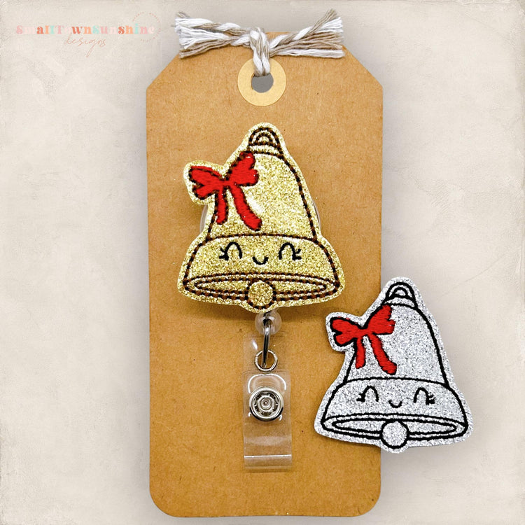 glittery christmas bell with red bow embroidered badge reel topper