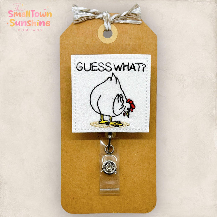 chicken bending over asking guess what? embroidered badge reel topper