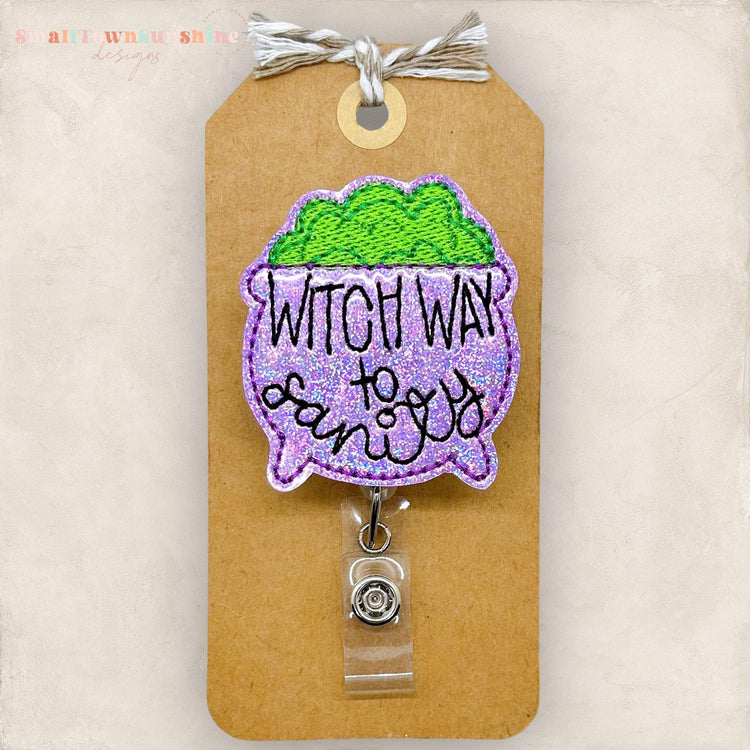 punny purple halloween cauldron embroidered badge reel