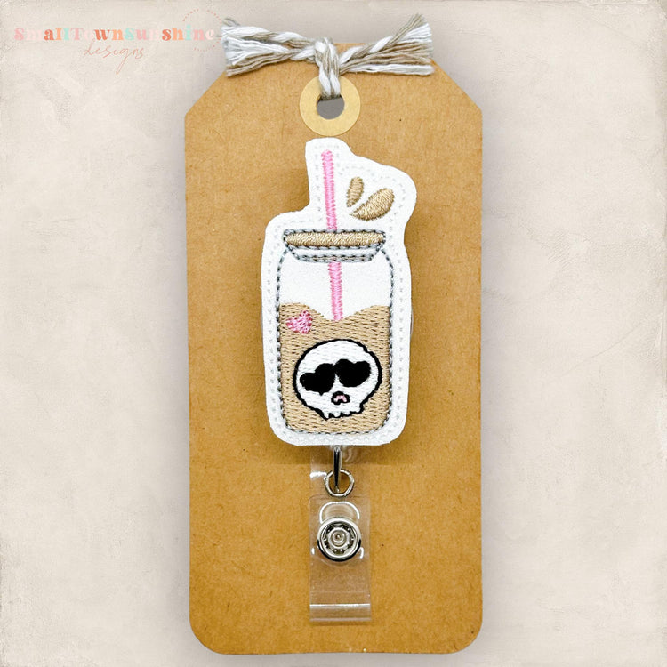 embroidered glass can with skull badge reel topper