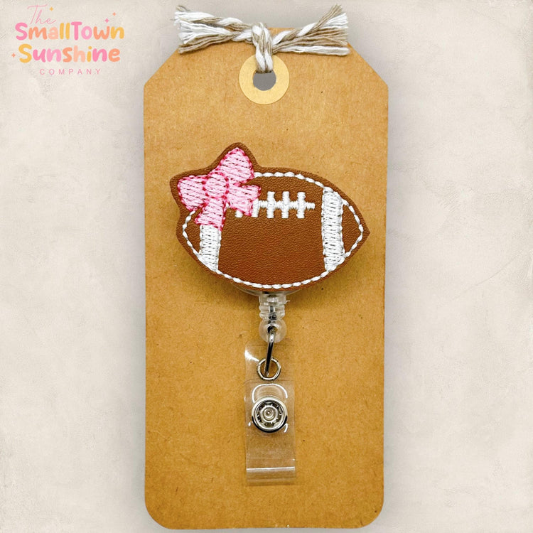 embroidered football with coquette pink bow