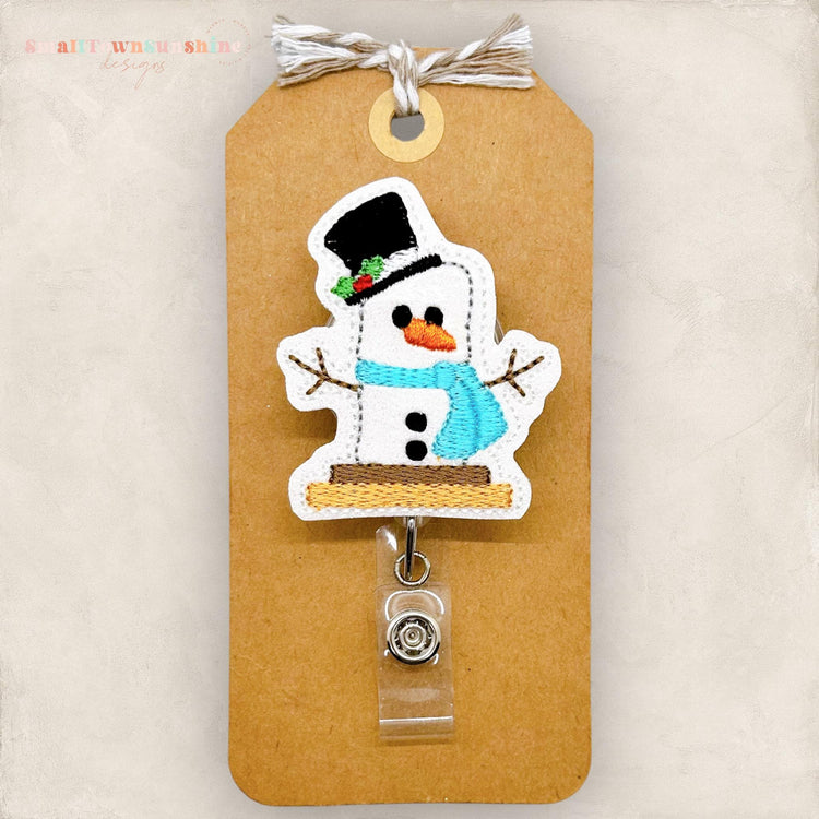 snowman smore with christmas top hat embroidered badge reel topper