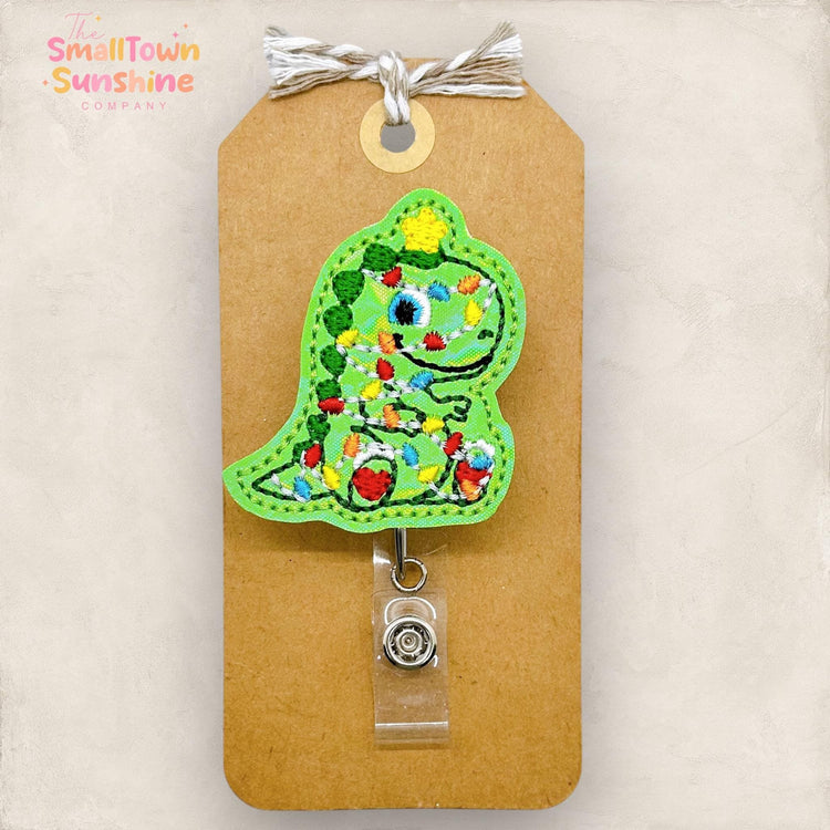 green t rex with christmas lights embroidered badge reel topper