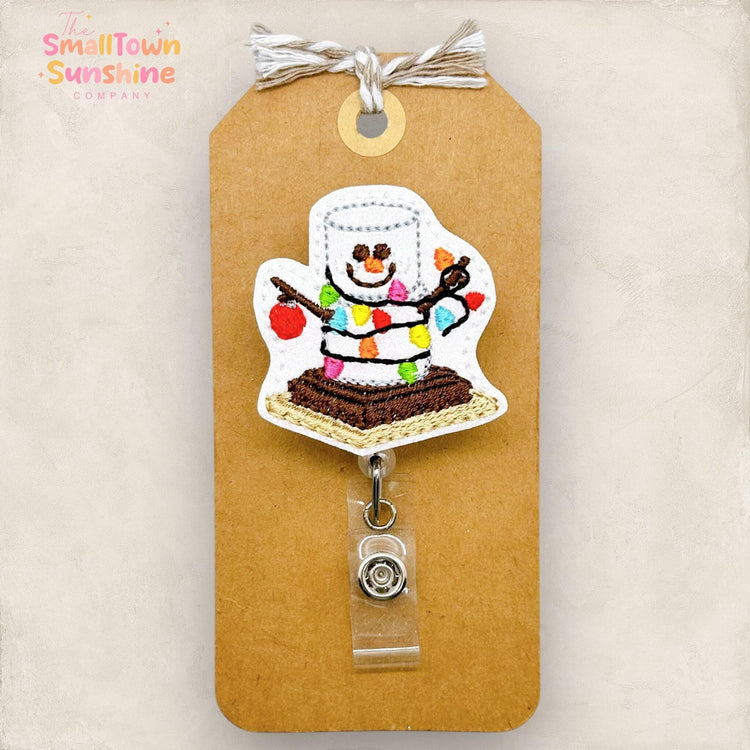 smore snowman wrapped in christmas lights badge reel