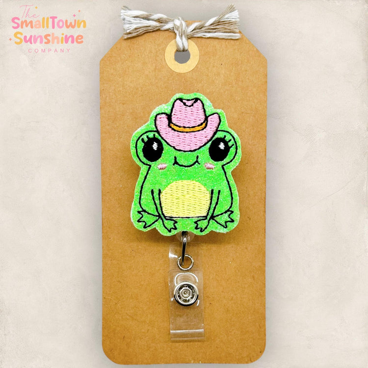 girlie green frog with pink cowboy hat embroidered badge reel topper