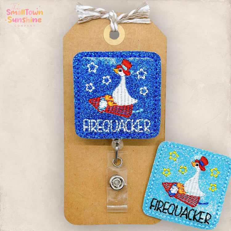 silly goose riding a fire cracker, embroidered badge reel, removable badge topper