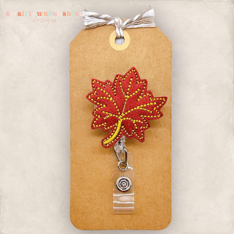 fall colored maple leaf badge reels