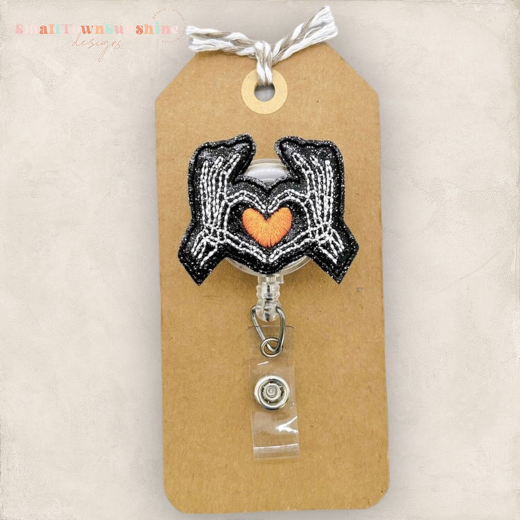 Skeleton Hands Heart Badge Topper