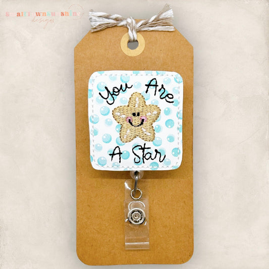 you are a star badge reel with an embroidered starfish