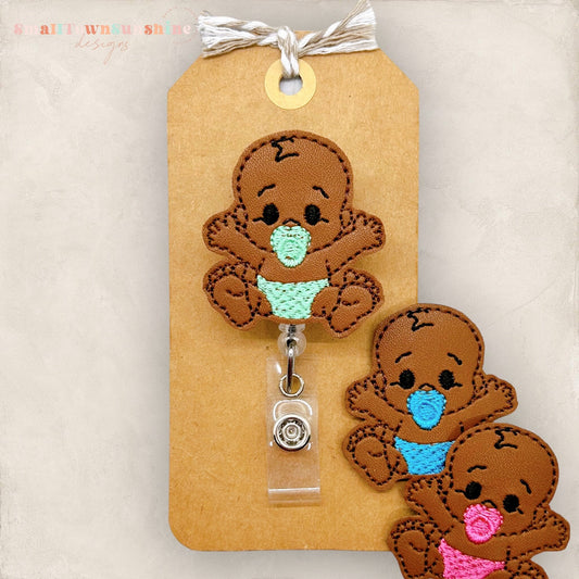 brown skin baby badge reel