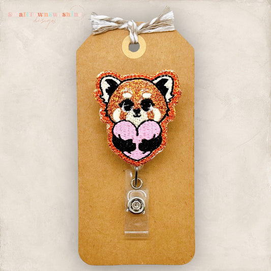 red panda hugging heart badge reel