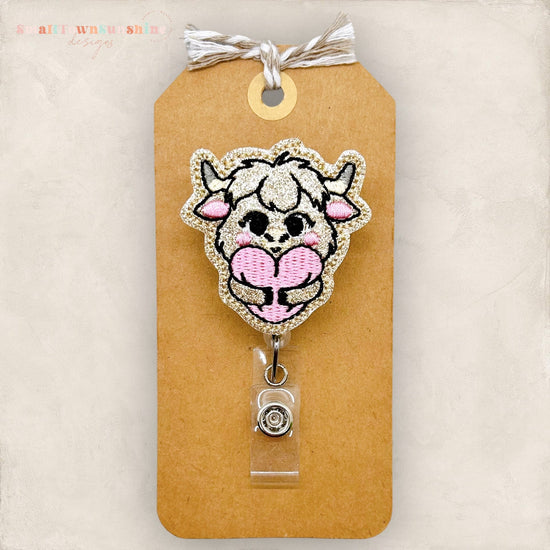highland cow hugging heart badge reel