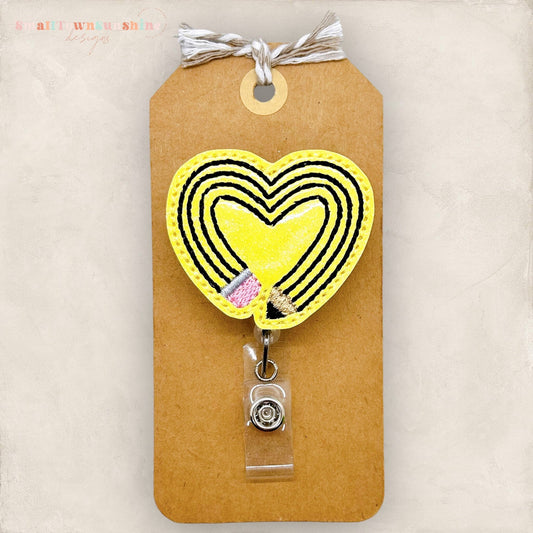 pencil shaped like a heart badge reel
