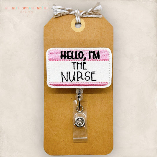 hello I&#39;m the nurse pink name tag badge reel