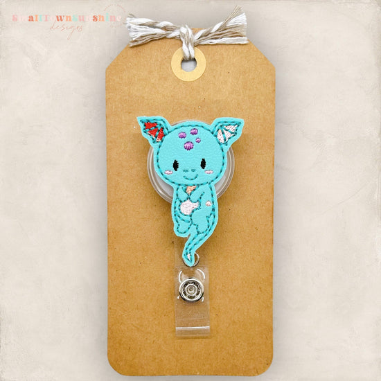teal dragon badge reel