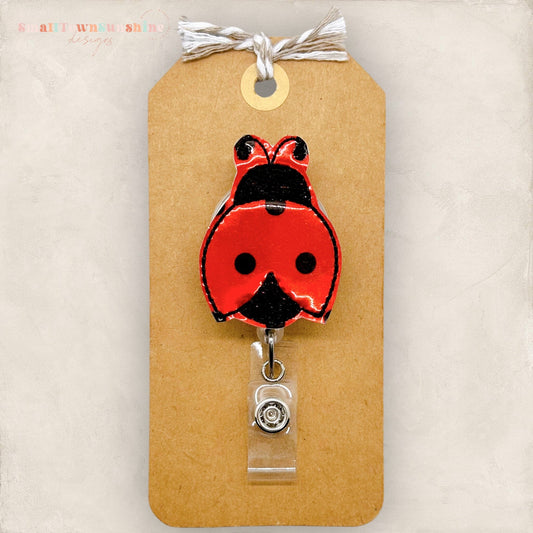 shiny embroidered vinyl badge reel